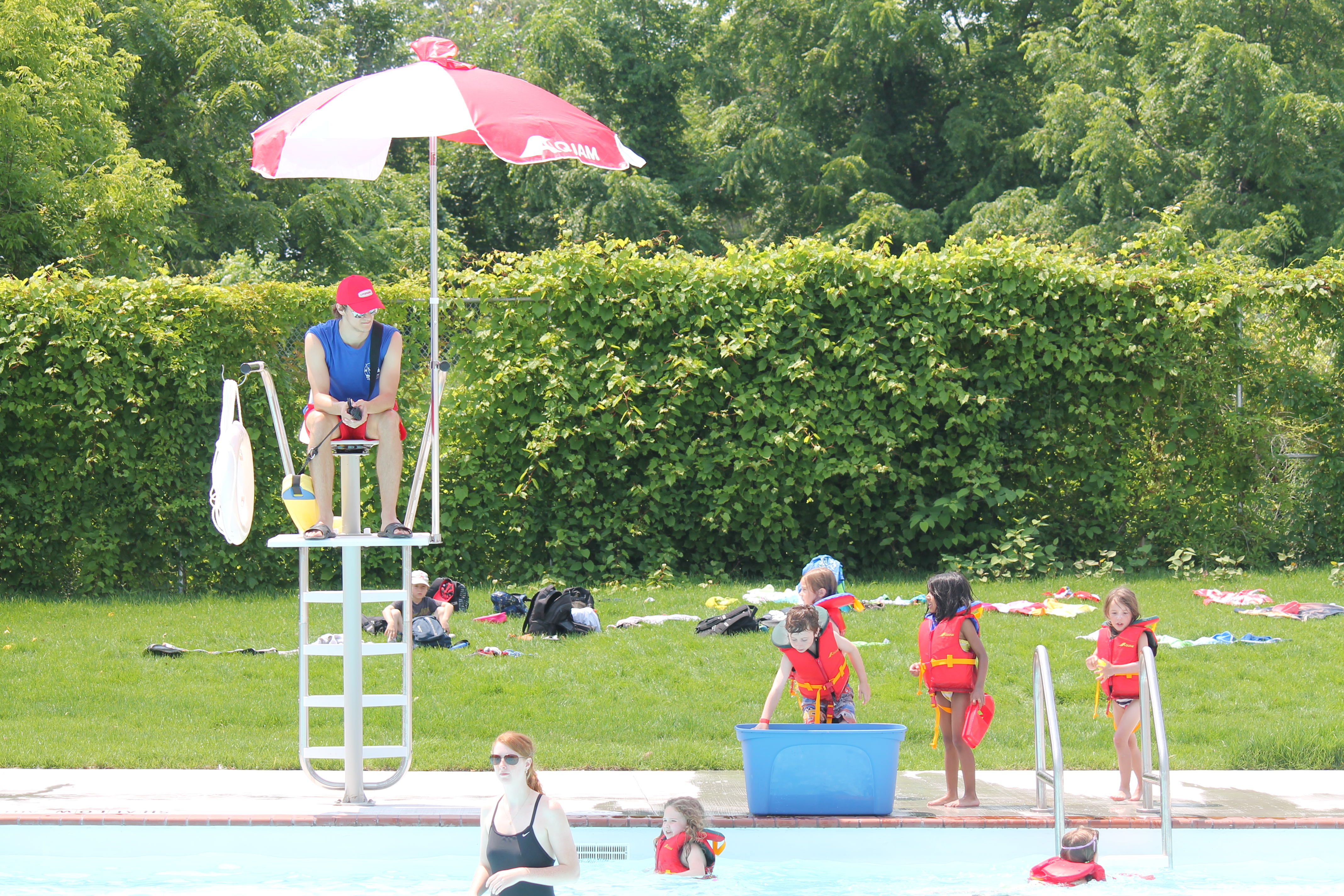 Kinsmen pool with children waiting by slide